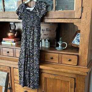 Floral Smocked Jumpsuit in Black with Multicolor Daisies